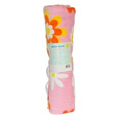 a pink blanket with orange and white flowers on the front, rolled up in half