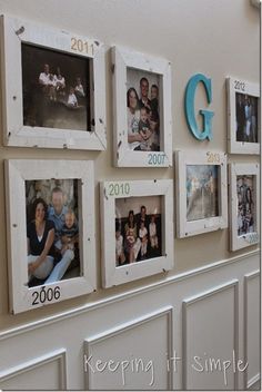 the family photos are hung on the wall with letters and numbers for years to come