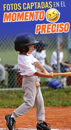 a young boy swinging a baseball bat on top of a field