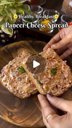 a person is holding a piece of bread on a wooden plate with the words, healthy breakfast paneer cheese spread