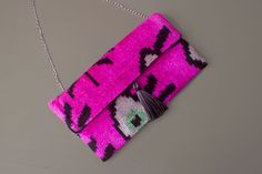 Pink velvet clutch bag---Customized Order Ikat fabrics are produced entirely by the hand-woven method. After the patterns on it are dyed, the weaving begins and is completed in a long time. The patterns are not prints. and it is completely handmade. 🔔 Pattern: Evil eyes 🔔 Color: Hot pink and Black  🔔 Size: 6.7 x 11.8  inches  15x30 cm 🔔 Care: Dry clean only 🔔 Closure: Magnetic 🔔 Exterior Blue evil eye velvet ikat fabric Gunmetal hardware  Interwoven chain  Magnetic closure  2023 production Pink Rectangular Clutch With Removable Pouch, Handmade Pink Clutch Bag, Pink Clutch With Removable Pouch, Chic Pink Clutch Pouch, Pink Clutch Evening Bag, Pink Handmade Pouch Clutch, Handmade Pink Rectangular Evening Bag, Chic Pink Rectangular Pouch, Chic Rectangular Pink Pouch