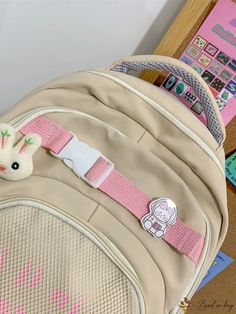 BirdinBag - School-ready Classic Backpack with Letter Graphics and Bag Charm - Medium Size Cute Beige Bags For Students, Cute Beige Rectangular Backpack, Cute Beige Backpack Bag, Cute Beige Backpack, Beige Bag For Study And Back To School, Beige Bags For Back To School, Medium Backpack, Classic Backpack, Color Khaki