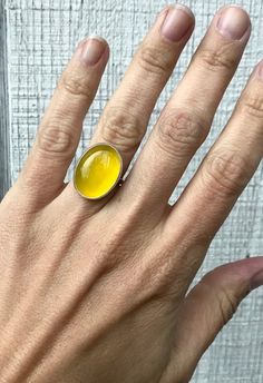 A lovely bright canary yellow agate has been set in sterling silver with a handmade ring band from sterling silver half dome wire. This yellow agate is 20mm x 15mm in size. An easy ring to wear that adds a pop of color to any outfit!Made to order! Each stone will vary slightly in color. Yellow Gemstone Ring, Yellow Agate, Yellow Gemstones, Fused Glass Jewelry, Canary Yellow, Agate Ring, Half Dome, Ring Band, Glass Jewelry