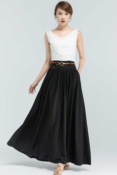 "This Black maxi skirt is the perfect piece for your wardrobe. The Linen skirts is perfect for an afternoon in the city or a walk in the country, the vintage skirt in a wonderful staple, this long skirt will match a variety of ensembles and makes this a must-have. For a twirl-worthy look, pair it with a white blouse or chunky knit sweater and you'll look stylish wherever you're going. Numerous pleats make this a roomy and comfortable skirt. DETAIL * 50% linen ,50% cotton * No Lining * Pleated wa Black A-line Maxi Skirt For Summer, Black Maxi Skirt For Workwear In Summer, Black Maxi Skirt For Summer Workwear, Summer A-line Voluminous Maxi Skirt, Summer Maxi Skirt With Pockets, Black A-line Pleated Skirt For Summer, Relaxed Summer Maxi Skirt With Pockets, Summer A-line Maxi Skirt With Pockets, Black Pleated Skirt With Elastic Waistband For Summer