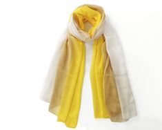 New arrival stylish yellow rainbow cotton scarf Fabric is so soft,long and transparent,made with lightweight fabric. Combined with yellow brown and white colors. Suitable for all seasons .Good match-up for daily clothing. Unisex gift to anyone who consider casual cloth accessories. Made from high-quality Turkish cotton mix Contains %70 cotton %30 polyester Not shrink anymore. Will become softer by the time. Code 248 Dimensions: Approximately [90 x 190 cm] weight: 100 gr Care instructions: - gent Bohemian Yellow Scarves For Beach, Elegant Yellow Summer Scarf, Yellow Bohemian Shawl Scarf, Cloth Accessories, Casual Yellow Scarf, One Size, Yellow One-size Shawl Scarf, Unisex Gift, Cotton Scarf, White Colors