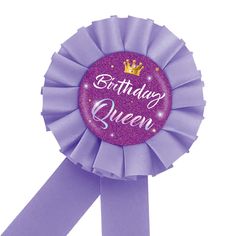 a purple rosette with the words birthday queen on it and a crown in the center