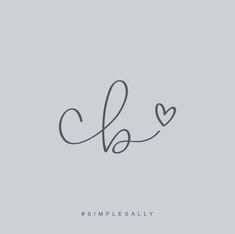 the word love is written in cursive handwriting on a gray background with a heart