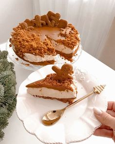 a person holding a fork near a piece of pie on a plate with another slice missing