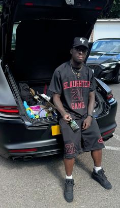 a man sitting in the trunk of a car