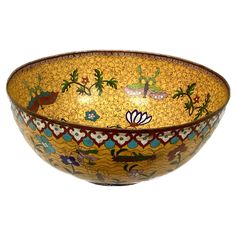 a decorative bowl is shown on a white background