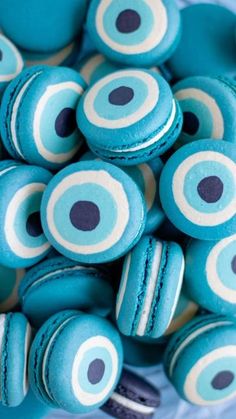 blue macaroons with white and black circles on them