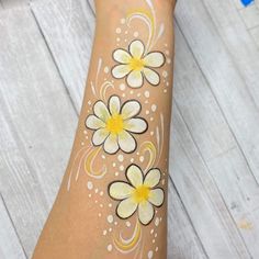 Sunflower Face Paint, Face Paint Sunflower, Face Painting Themes, Flower Power Face Paint, Yellow Face Paint, Flower Eye Face Paint, Flower Face Paint On Arm, Tiny Flower Tattoos