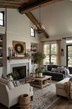 a living room filled with furniture and a fire place in the middle of a room