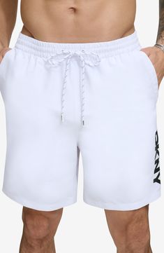 Hit the boardwalk or go for a swim in these volley swim trunks built from quick-drying fabric with UPF 40+ sun protection. 7" inseam (size Medium) Elastic/drawstring waist 100% REPREVE® recycled polyester REPREVE recycled polyester is made from 100% post-consumer recycled plastic bottles Machine wash, line dry Imported White Summer Shorts For Outdoor, White Swim Trunks With Upf 50+ For Beach, White Swim Trunks Upf 50+ For Beach, White Beachwear Swimwear For Outdoor, White Summer Swimwear For Outdoor, White Upf 50+ Swim Trunks For Beach, White Beach Season Shorts For Outdoor, White Shorts For Beach Season Outdoor Activities, White Summer Outdoor Swimwear