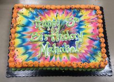 the birthday cake is decorated with tie dye