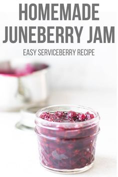 homemade blueberry jam in a glass jar with text overlay reading homemade juneberry jam easy service recipe