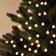 a christmas tree with white lights on it