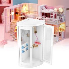 a doll house with furniture and accessories in it