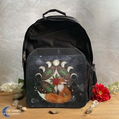 'SPIRIT OF THE FOX' BACKPACK A firm and sturdy backpack with an own illustration of a fox spirit animal.  Own Design Product This is an unique product with an design of SB Designs Creations. SPECIFICATIONS - Size backpack: 40 cm x 30 cm  ( 15.8 inch x 11.8 inch). - Size illustrative print: 24,5 cm x 21,5 cm (9.7 inch x 8.5 inch). - Size front pocket: 24 cm x 20 cm (24 cm x 20 cm (9.5 x 7.9 inch).  - Bag is made from strong & firm fabric/polyester. - High quality print. - Water repellent bag / waterproof illustration(print). - Different compartments with zippers. - The illustrative flap of the bag is attached with velcro and opens/closes with velcro.  - The length of the shoulder straps are adjustable (buckles). - Padded back & padded shoulder straps. The bag is made from high quality polye Dream Magick, Fox Backpack, Fox Spirit Animal, Fantasy Bag, Spirit Witch, Sturdy Backpack, Witch Bag, Inch Bag, Animal Backpacks