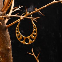 Introducing the captivating "Apollo Earrings," crafted from brass and inspired by the mesmerizing faces of the moon. These enchanting hoop earrings, with a 2-inch size, showcase the lunar phases in exquisite detail. Each earring represents a different lunar expression, evoking the cosmic allure of the moon's ever-changing beauty. The Apollo Earrings symbolize the passage of time and the cyclical nature of life. Embrace the celestial charm of these earrings and let your style shine with the encha Faces Of The Moon, Lunar Phases, Engraved Earrings, Earrings Gold Hoop, Lunar Phase, Chunky Hoop Earrings, Earrings Hoops, Hoop Earrings Gold, Earring Crafts