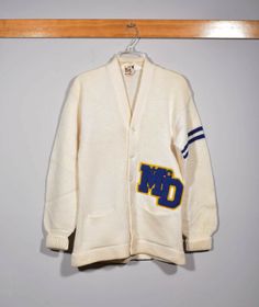 50s 60s Princeton All Wool Cream Bishop McDevitt HS Varsity Letterman Sweater 50s 60s Princeton All Wool Cream Bishop McDevitt HS Varsity Letterman Sweater Material: 100% Wool Condition details: There is some light pilling as well as a very small mark on the back.MEASUREMENTS ARE IN INCHES Shoulder to shoulder: 18   Chest: 36   Sleeve Length: 23  Garment Length: 28.5   HOW WE MEASURE Our measurements are taken with item laying flat and buttons closed. Shoulder to shoulder: Taken from seam to sea Varsity Sweater Outfit Cardigans, Vintage White College Outerwear, Vintage White Outerwear For College, White Retro Cotton Sweater, Vintage White Sweater For College, White Vintage Sweater For College, Vintage White Cotton Outerwear, White Vintage Cotton Outerwear, White Fitted Retro Cardigan