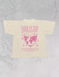 Show that Love is the Answer in our Y2K inspired varsity, oversized t-shirt, perfect for Valentine's Day & every day after. - Features the phrase "Love is the Answer" with the Earth shaped like a heart in the center and a small quote about Love underneath all in a pink ink across the front - Screen print transfer that is heat pressed onto each tshirt - Tshirt is a high quality, garment dyed, vintage wash that gets softer after each wash - Oversized fit - Sizing translation: XS/S = L , S/M = XL , L/XL = 2XL , 2XL/3XL = 3XL - 100% Cotton **due to screens & filters color may vary from pictures** Shirt Design Y2k, Tshirt Typography Design, Collage Tshirt, Graphic Design Tee, Quote About Love, Tshirt Quotes, Love Is The Answer, Y2k T Shirt, Merch Design