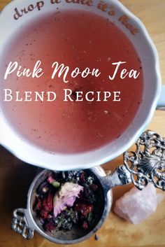 the pink moon tea blend recipe is in a white bowl on top of a wooden table