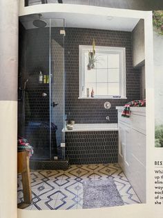 an open magazine showing a bathroom with black and white tile