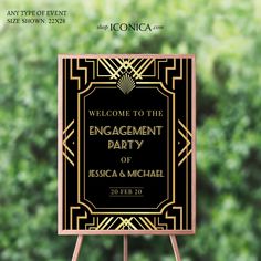 a welcome sign for an engagement party in black and gold with the words, welcome to the engaged party of essica & michael