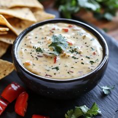 a bowl of quesadilla dip with tortilla chips on the side