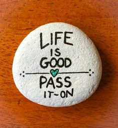 a rock that says life is good pass it on