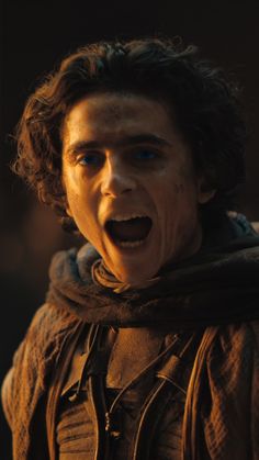 a young man with his mouth open in the movie game of thrones, showing off his teeth