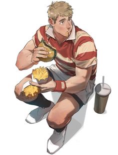 a man sitting on the ground holding a hot dog and french fries in his hands