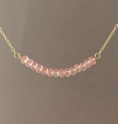 Pretty pink cherry quartz stones line up in a row and hangs on a 14k gold fill, 14k rose gold fill, or sterling silver chain. Stones measure approx 1.5 inches lined up. You can choose the length you want when you checkout. If you want a size smaller than 16 inches, let me know when you checkout. You can add an extension chain to your necklace by adding this item to your cart: https://www.etsy.com/listing/182425506/add-on-extension-chain-gold-fill-or Item comes packaged in a little brown box. Pearl Jewelry Gift, Pearl Strands Necklace, Cherry Quartz, Pearl Necklace Earrings, Pink Rose Quartz, Silver Bead Necklace, Cultured Pearl Necklace, Gemstone Beaded Necklace, Gold Bead Necklace