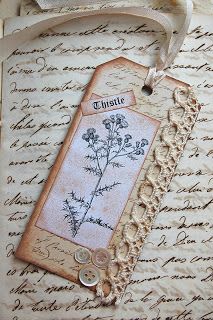 an old fashioned tag with a flower on it