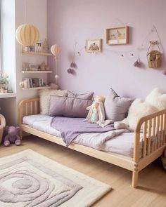 a child's bedroom with purple walls and white furniture, including a wooden daybed