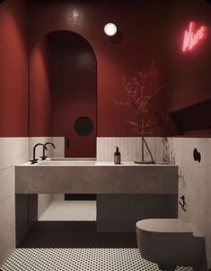 a bathroom with red walls and black and white flooring