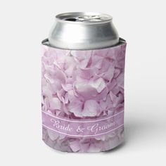 a can cooler with pink flowers on it