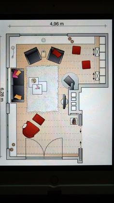 a computer screen showing a living room with furniture and floor plans on the display area