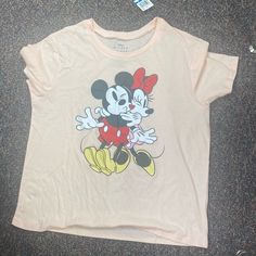 a t - shirt with a mickey mouse on it