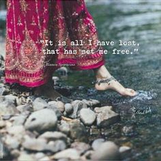 a woman's feet in the water with a quote on it that says, what is all i have lost, that has set me free