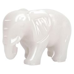 an elephant shaped glass figurine is shown against a white background with the letter m on it's trunk