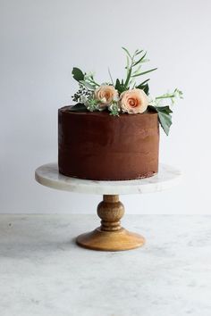 a chocolate cake with fresh flowers on top