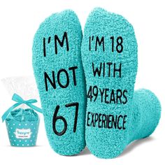 two blue slippers with the words i'm not with years experience written on them