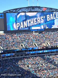 a stadium filled with lots of people sitting in the bleachers