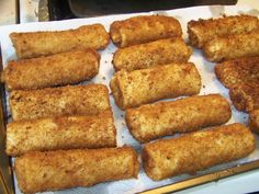 some fried food is sitting on a paper towel and ready to be cooked in the oven