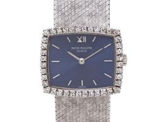 Blue dial with baton hour markers, diamond set bezel, textured milanese bracelet, in 18k white gold. Dial and clasp signed Patek Philippe. Minor wear to crystal at 11 o'clock. Diamond Watches Women, Jewellery Marketing, Diamond Set, Diamond Watch, Patek Philippe, O Clock, Markers, Clock, Gems