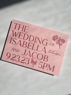 a pink ticket for the wedding of isabiella and jacob on display