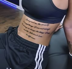 a woman's stomach with the words on it and her name written in cursive writing