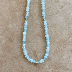 This beautiful aquamarine necklace is crafted with shaded sea blue beads and gold bead accents, creating an elegant and timeless piece. The combination of gold and aquamarine come together to create an eye-catching necklace. Length 16" Aquamarines inspires truth, trust and letting go. In ancient lore, Aquamarine was believed to be the treasure of mermaids, and was used by sailors as a talisman of good luck, fearlessness and protection. It was also considered a stone of eternal youth and happines Eternal Youth, Aquamarine Necklace, Aquamarine Beads, Aqua Marine, Sea Blue, Blue Beads, Gold Beads, Come Together, Necklace Length